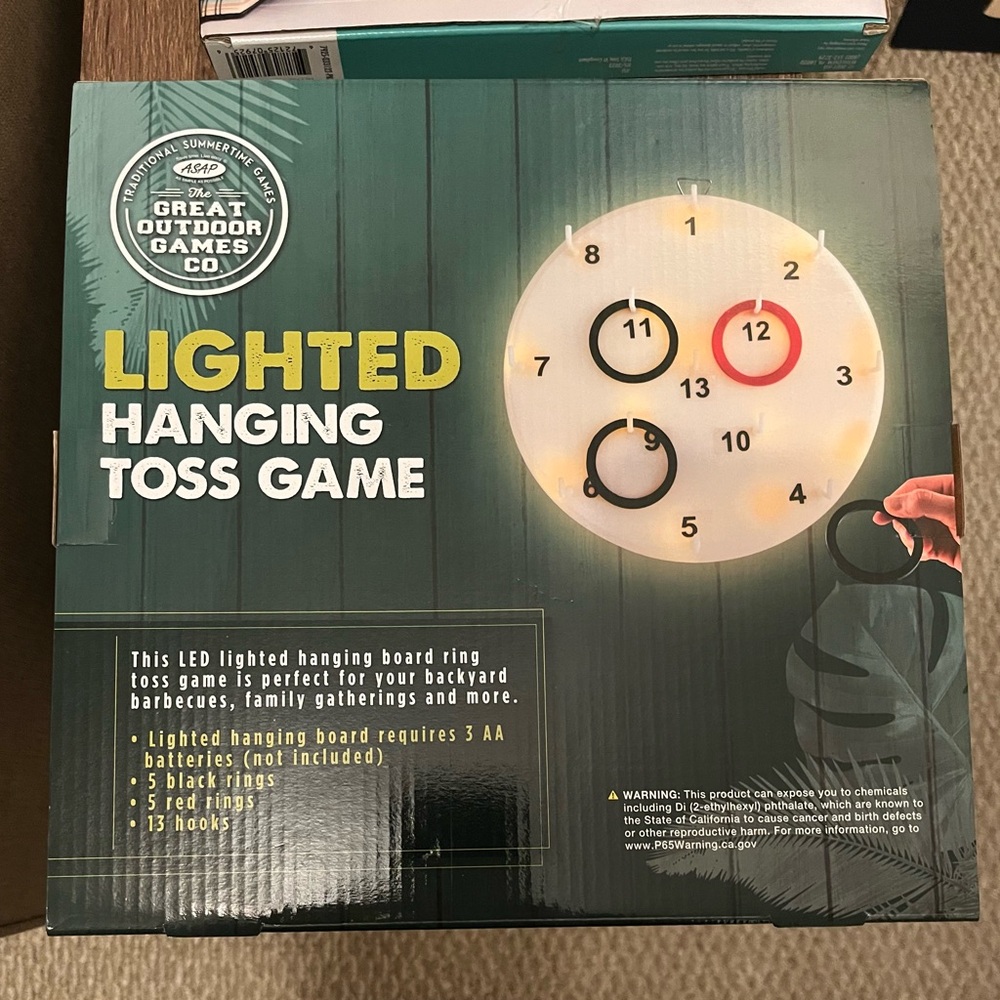 Lighted hang toss game